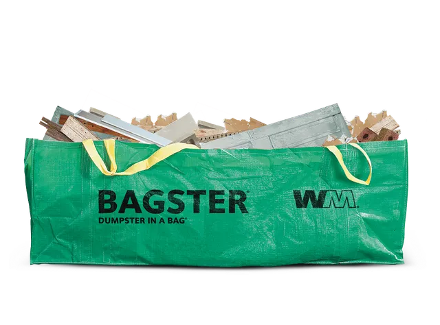 Green WM Bagster bag full of debris